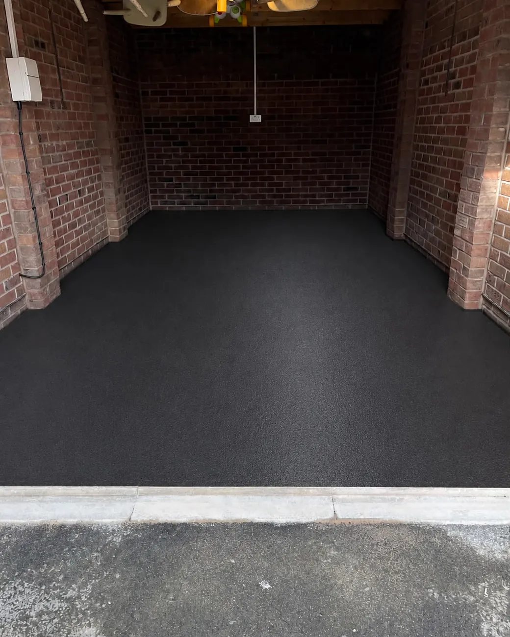 Finished charcoal epoxy garage floor