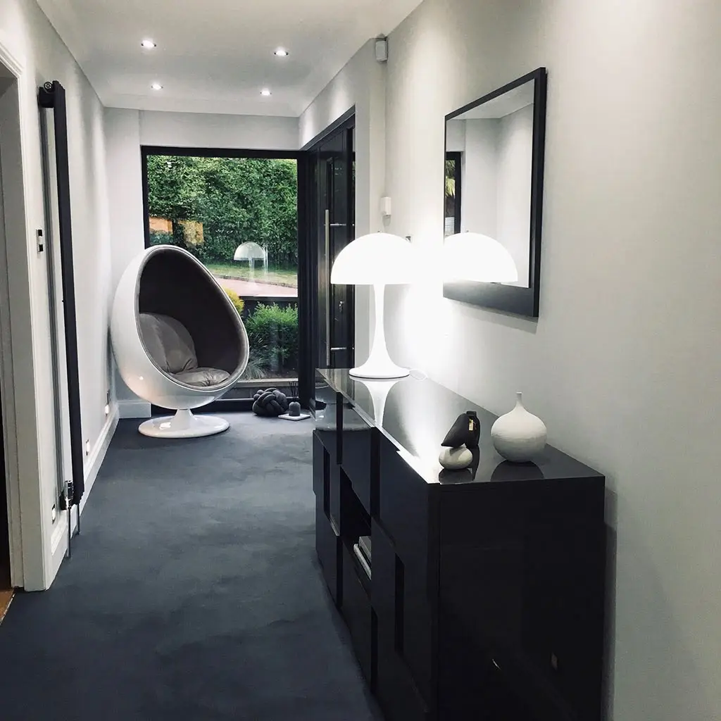 Poured resin floor in a Derbyshire hallway, seamless dark finish