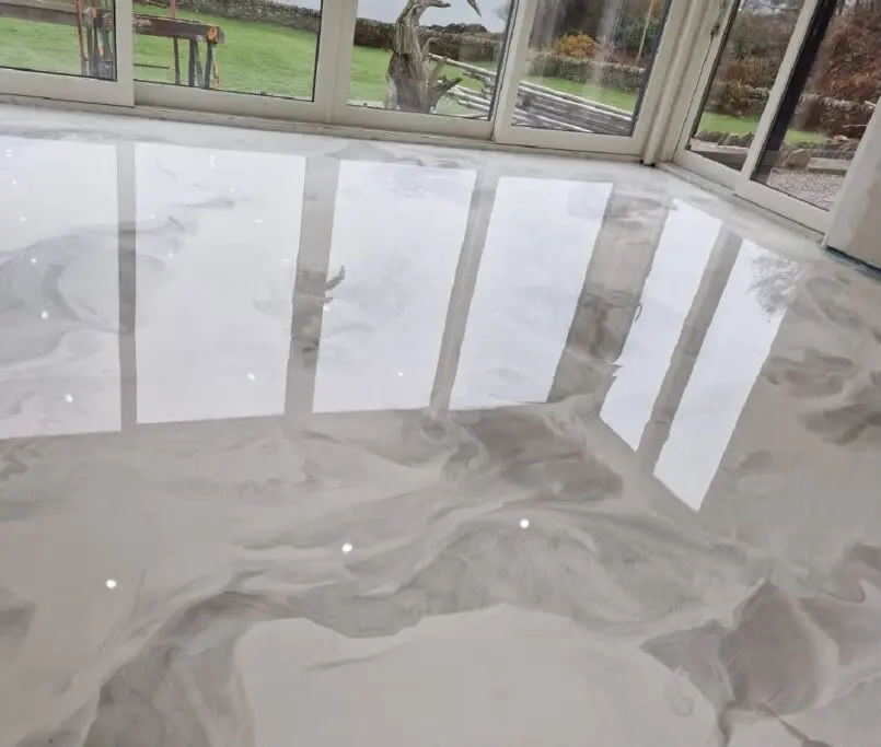 White marble effect resin floor in a garden room